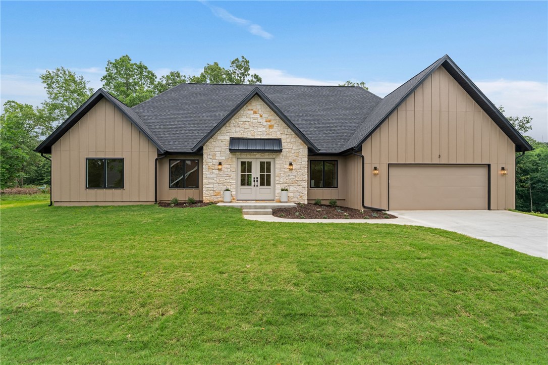 High quality new construction on a rare FLAT .4 acre lot! Designed with timeless elegance and modern functionality, this home features a spacious open-concept living area, large bedrooms, custom cabinetry, over-sized garage, walk-in pantry, quartz countertops, designer finishes, and high-end details throughout. 

The exterior showcases natural limestone and SmartSide siding for exceptional curb appeal and durability. The kitchen is equipped with GE appliances, including a gas range, while an American Standard HVAC system provides year-round comfort. 

Additional highlights include an insulated laundry room and thoughtfully designed living spaces. Conveniently located .4 miles from Stoneykirk Boat Ramp and Park. Minutes from Branchwood Nature Trail, Rec Center, Pickleball courts, Frisbee Golf, Highland Golf Course, Pub and I-49.  Nearby Mountain Bike Trails proposed on Bella Vista’s Master Plan.  See video under "Virtual Tour Link". Agent Owned.