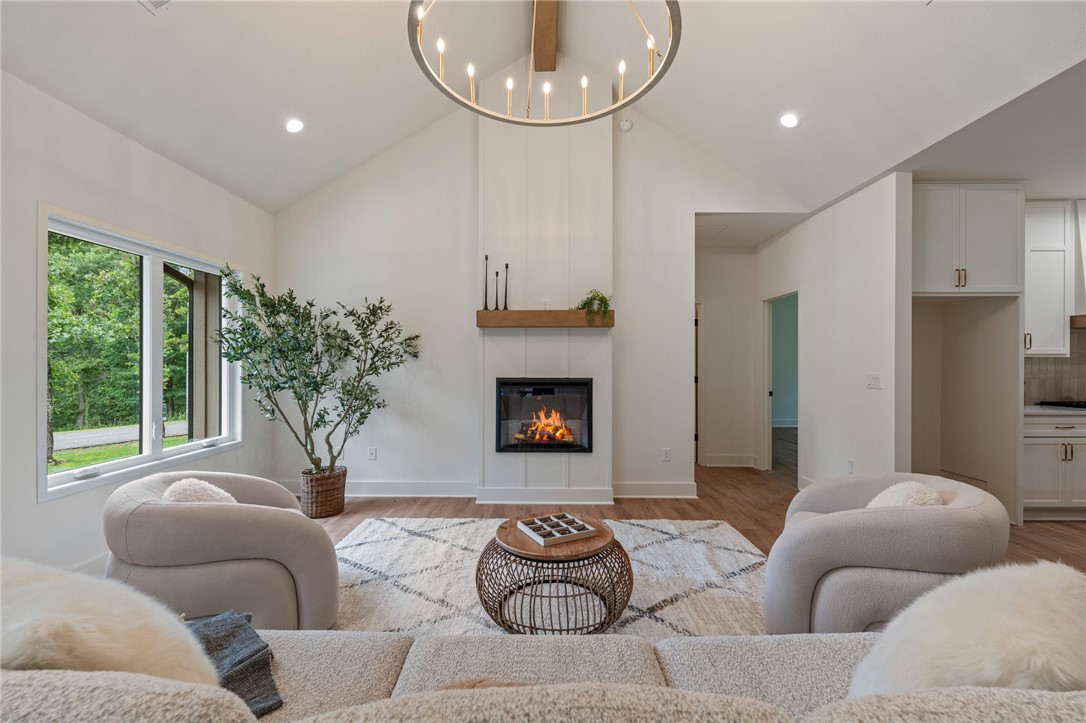 High quality new construction on a rare FLAT .4 acre lot! Designed with timeless elegance and modern functionality, this home features a spacious open-concept living area, large bedrooms, custom cabinetry, over-sized garage, walk-in pantry, quartz countertops, designer finishes, and high-end details throughout. 

The exterior showcases natural limestone and SmartSide siding for exceptional curb appeal and durability. The kitchen is equipped with GE appliances, including a gas range, while an American Standard HVAC system provides year-round comfort. 

Additional highlights include an insulated laundry room and thoughtfully designed living spaces. Conveniently located .4 miles from Stoneykirk Boat Ramp and Park. Minutes from Branchwood Nature Trail, Rec Center, Pickleball courts, Frisbee Golf, Highland Golf Course, Pub and I-49.  Nearby Mountain Bike Trails proposed on Bella Vista’s Master Plan.  See video under "Virtual Tour Link". Agent Owned.