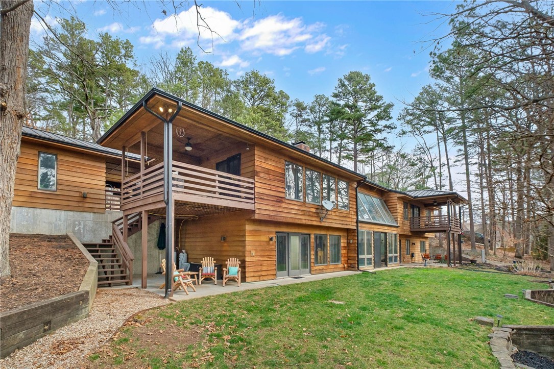 This extraordinary 4 bed, 4 bath, 5,480 sq ft lakefront home is as impressive in size as it is in character. A truly unique mid-century designed property offering unmatched space, flexibility, and stunning waterfront living. The main level is thoughtfully designed with three bedrooms, an office, and a warm, inviting kitchen that flows effortlessly into the living and dining areas, creating a natural hub for everyday living and entertaining.
The lower level expands the possibilities even further, featuring an additional bedroom, oversized family room, bright sunroom, utility room, and a versatile bonus space currently serving as a workout room. Whether you envision a media lounge, guest retreat, game room, or wood shop, this home easily adapts to your lifestyle.  With its expansive layout, distinctive design, and prime lakefront setting, this is far from ordinary, it’s a statement property.  Schedule your private tour today and experience the scale and uniqueness for yourself.