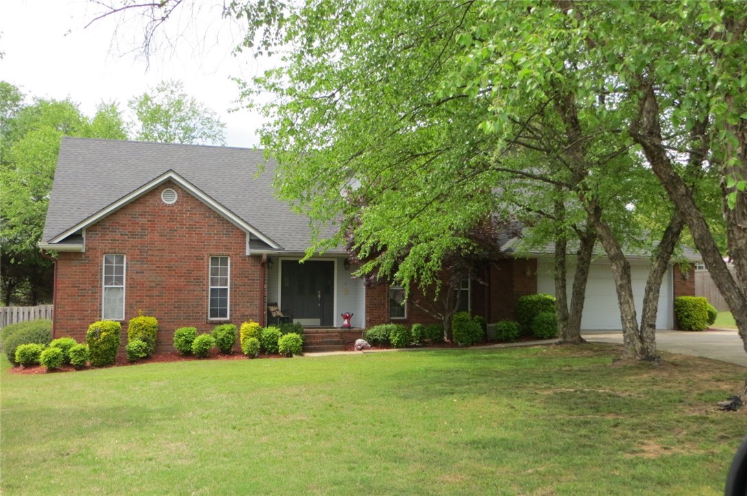 Wonderful, established neighborhood! 4 BR/ 2.5 BA w/ formal dining room or office, under stairwell storage, lots of closet space & nice utility room w/ laundry sink & cabinets. Master is downstairs w/ large whirlpool tub, double vanities & dressing table. Tree shaded yard, privacy fencing, beautiful in ground sports pool and a storage building with concrete floor & electric. New carpet thru-out.