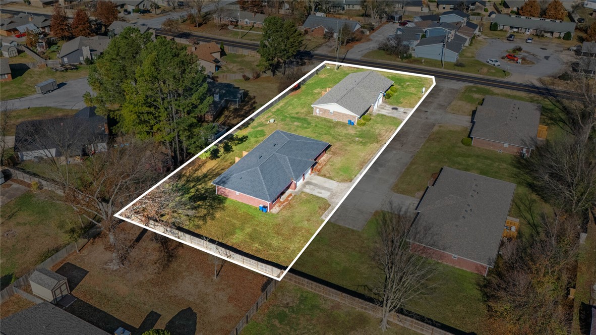 Well located .75 acres just off Tiger Blvd/Walton Blvd.  Possible fantastic infill development.  All utilities appear to be at street (NW 12th St).  Flat acreage and close to trails and downtown.  Currently zoned R-1.  Priced aggressively at $34 SF.  Two duplexes currently on property could provide some short term rental income during development process.  See attached plat.  Two of the four units are tenant occupied, please do not disturb tenants.  Buyers to confirm all development options with City of Bentonville.  Also listed as multifamily - See MLS # 1344927.