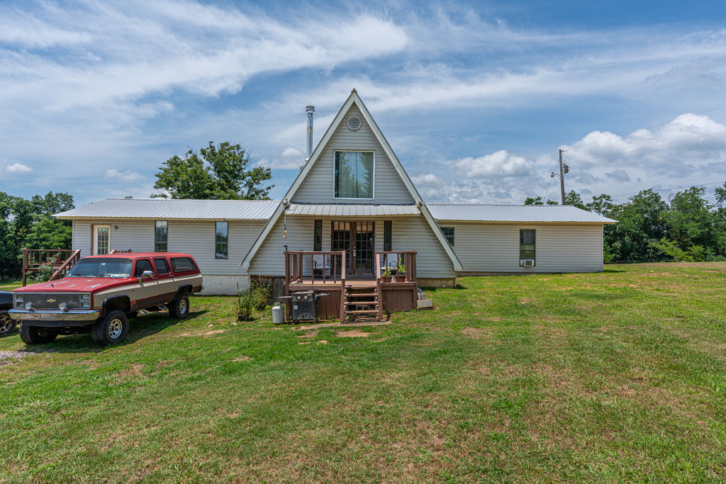 Check out this spacious 2-level A-frame home featuring 5 bedrooms, 3 bathrooms & spacious eat-in kitchen. Upon entering the home, you will love the high ceiling in the comfy living room with a wood-burning stove. With a little TLC, you can add your preferences & make this home a stunner. With 6.3 acres, this property has plenty of room for your animals, hobbies, gardening, & wildlife watching. Schedule your showing today.