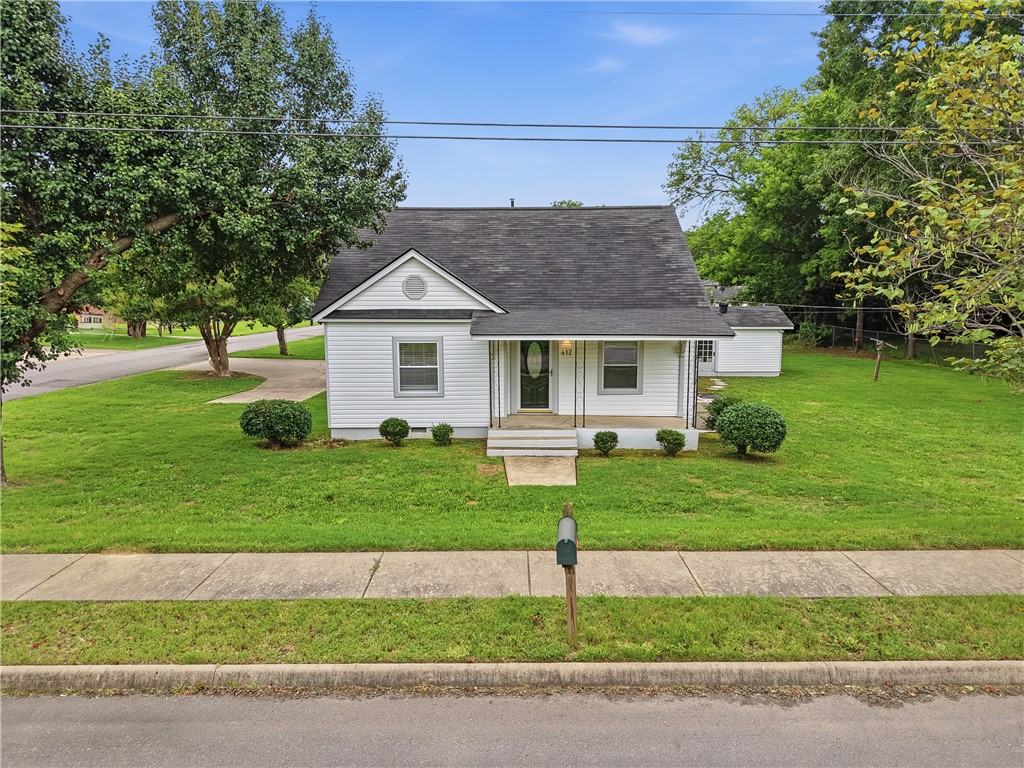 Completely remodeled and move-in ready! This charming 3-bedroom, 1-bath home sits on a huge corner lot in a convenient location close to shopping, dining, schools, & Arkansas Tech University. Inside, you’ll find fresh paint, updated fixtures, & new luxury vinyl flooring throughout, creating a bright & welcoming atmosphere. The kitchen features clean white cabinetry & ample storage, while the separate laundry room adds everyday convenience & additional storage. Enjoy a bonus space that could act as a second living room, office, or another bedroom! The large covered carport offers plenty of parking and can easily double as an excellent space for entertaining family & friends. A detached garage/shop provides room for hobbies, parking, projects, or additional storage, & the separate lawn storage area offers even more flexibility. With attractive curb appeal, functional outdoor spaces, & tasteful updates throughout, this home is an excellent opportunity for first-time buyers, students, downsizers, or investors alike.