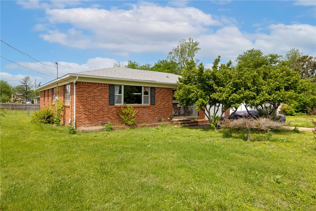 Located in the heart of downtown Bentonville, this property sits on a rare and desirable 2-parcel site totaling 0.31 acres, offering endless potential. The home features three spacious bedrooms, along with a generous living and dining area that’s perfect for gathering and entertaining. Large windows throughout fill the space with abundant natural light, creating a warm and inviting atmosphere. 

Whether you're an investor, builder, or buyer with vision, this property presents an exceptional opportunity. Renovate and update the existing home, expand to create your dream residence, or take advantage of the oversized lot to build multiple homes or townhomes. With its prime location and valuable lot size, the possibilities here are truly unmatched. Also listed for $700k with house and only one .16 parcel.