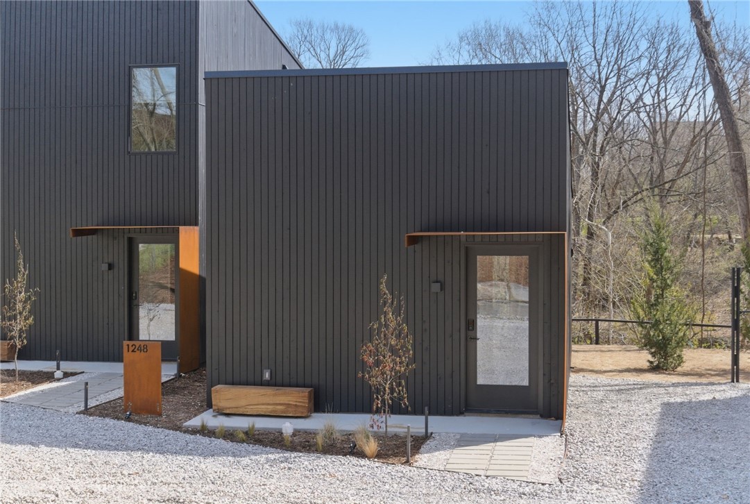 Modern creekside cabins just 1 mile from Bentonville Square! Perfect for investors, corporate buyers, or
young professionals seeking downtown access with the ability to offset cost of living. Each parcel includes
2 dwellings (6 total across 3 lots / 0.58 acres) backing up to Black Apple Creek with waterfall and trail
views. R-2 zoning with new sewer and utilities, shared access drive. Suite 1: 376 SF studio 1 bath. Suite 2:  892 SF 2 bed 1.5 bath. High-end finishes include cedar rainscreen, concrete floors, stainless appliances, and high-efficiency cassette mini-splits. Buy one parcel or all three at a portfolio discount. Buyer to verify all details.