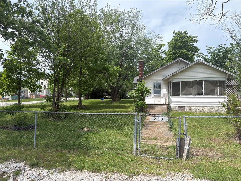 Large lot and as is home.  Home is almost gutted and needs full repair. Lot has road frontage on 2 sides as city  streets and 1 other side is alley way. This lot is large and has so much potential