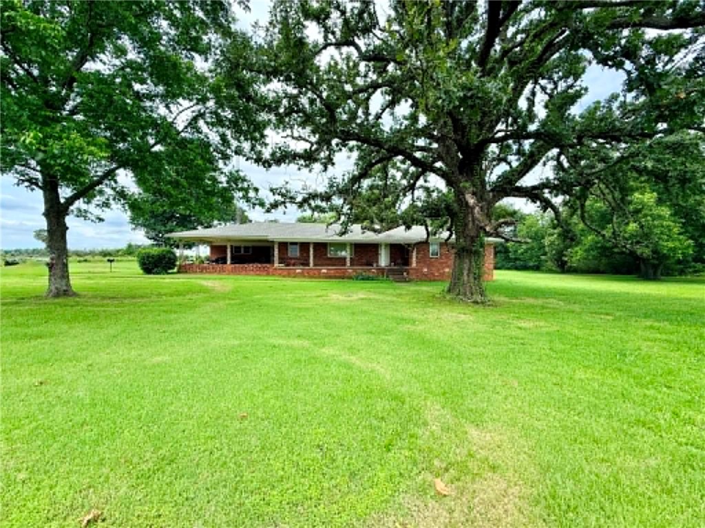Welcome home to this charming and well-built 3-bedroom, 2-bath home sitting proudly on 4.85 acres. Full of character and timeless appeal, this older home offers the kind of warmth and craftsmanship that is hard to find today. With two separate living areas, there is plenty of space for gathering with family, entertaining guests, or simply enjoying a cozy evening at home. The home features a large laundry room, an attic fan, and numerous updates including a new HVAC system installed in 2018 and a new roof in December 2019, giving peace of mind to the next owners. Outside, you’ll find a two-car carport and plenty of room for animals, gardening, or outdoor enjoyment. This property offers both rural water and a well on site (well has not been used in years and has no pump). Whether you are looking for a place to raise a family, enjoy country-style living with city conveniences, or simply settle into a home filled with charm and memories waiting to be made, this one is ready to welcome its next family home.