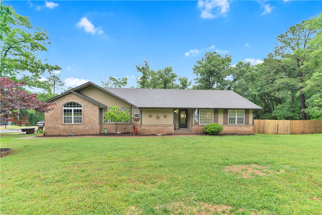 Beautifully updated home in Bella Vista situated on a desirable corner lot with direct access to the scenic Back 40 Trail and located just minutes from Lake Ann, Lake Rayburn, and the OZ Bike Lift! Enjoy the perfect blend of outdoor adventure and peaceful living with a private backyard setting and fresh updates throughout. Recent 2025 upgrades include a new back deck, privacy fence, and a new HVAC system, plus a beautifully renovated primary bathroom featuring a spacious walk-in shower. The bonus room above the garage offers flexible space for a home office, movie room, playroom, or second living area. Ideal for biking enthusiasts, nature lovers, or anyone looking to enjoy all that Bella Vista living has to offer!