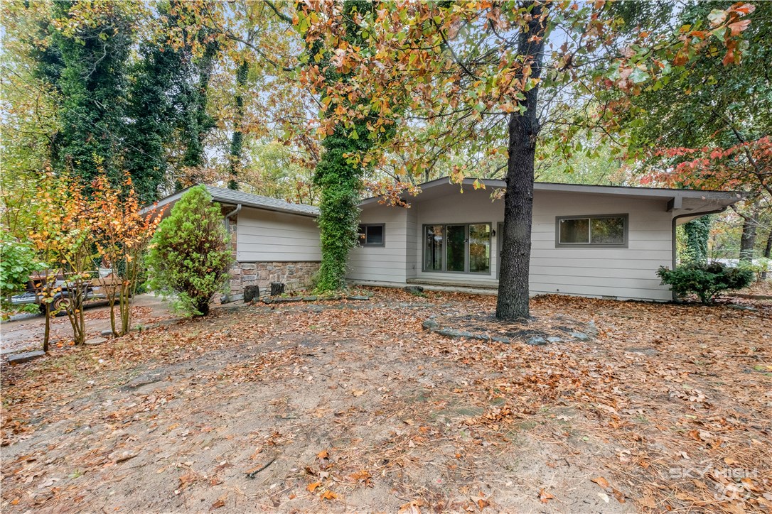 Welcome To Your Next Home! Updated 3 Bedroom With Open Floorplan. 2 Living Areas. High Ceilings In Main Living Area With Rock Fireplace And Large Windows For Great Natural Lighting. Spacious Kitchen And Dining Area. Large Bonus/Den Off Kitchen. Slider Leads To Nice Covered Deck. Large 0.37 Lot With Mature Trees All Around. New Paint Inside And Out. New Flooring, Appliances, Lighting, Fixtures, Granite Counters And Much More! 2 Lakes And Trails Nearby. Easy Access To 71b/I49.