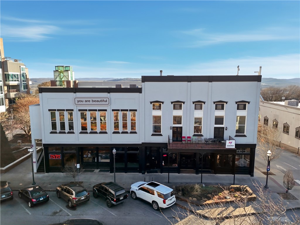+/- 686 SF of flexible office/retail space with glass front storefront opening to the beautiful courtyard in iconic Downtown Fayetteville Square! This space offers a large co-working space, private bathroom, sink for a kitchnette space, storage closet, new paint, modern LED flat panel lighting, and new trim. Located in the same building as Tiny Tim's Pizza, right next door to Jammin Java, and just up the street from Hugo's Restaurant, there are many great places to grab lunch or visit on break. Private parking spots available in attached parking garage for $210/mo with elevator access to street and other businesses. If your looking for a private and modern office space in the heart of Fayetteville, this is the space you are looking for!
