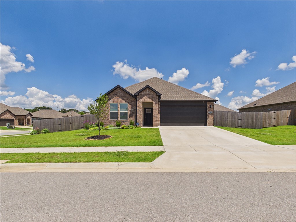 Nearly new construction without the wait — this exceptional 4-bedroom home on a corner lot in Pea Ridge is just 2 years old and move-in ready with all appliances conveying. Tucked at the back of the subdivision, you'll enjoy the peace and quiet of an established setting with no new construction noise. The open living, kitchen, and dining area is perfect for family gatherings and everyday entertaining, while the fenced backyard offers plenty of room to play on this generously sized corner lot. The garage features a 220-volt outlet supporting Level 2 EV charging — a rare and valuable upgrade. Multiple routes provide easy access to Rogers and Bentonville, and schools are nearby. Quality construction, thoughtful features, and a location that checks every box.