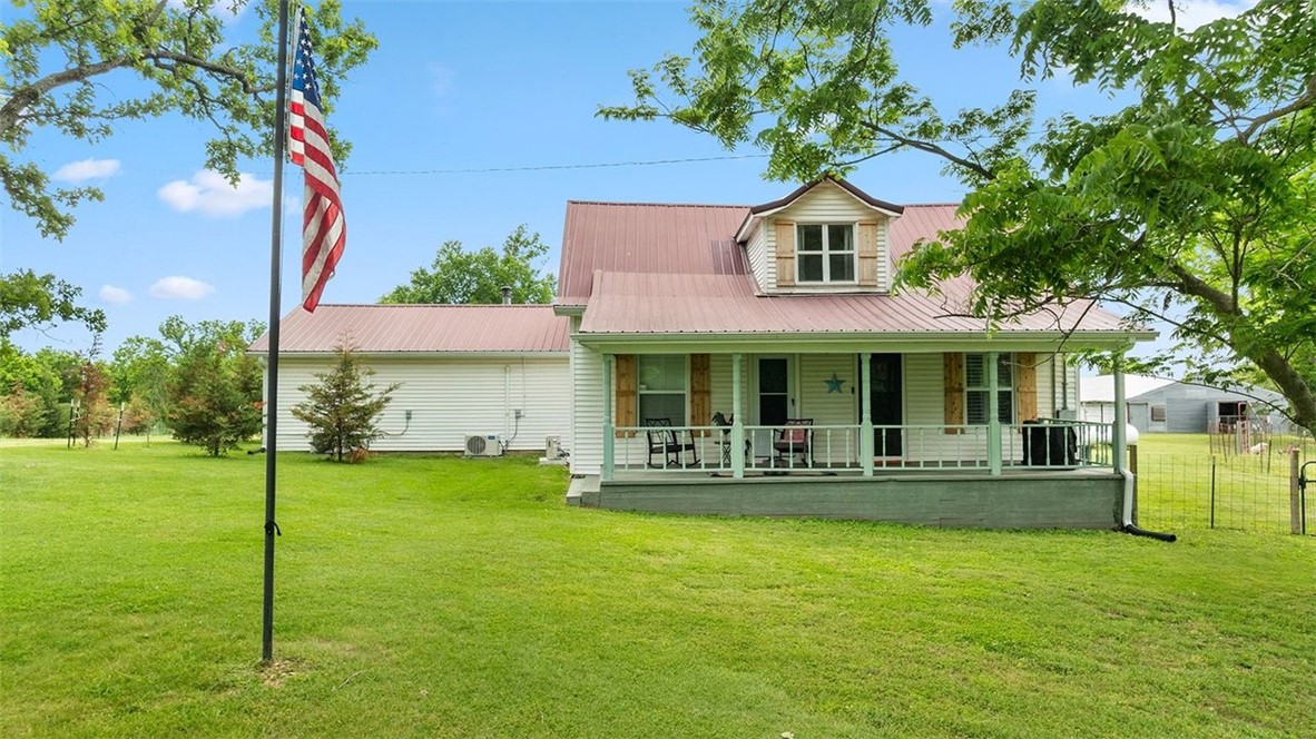A beautifully updated 1935 farmhouse situated on approximately 4 acres just minutes from Rogers and Beaver Lake. This 4-bedroom, 3-bath home offers over 2,500 sq ft of character and modern upgrades, including new HVAC and mini-splits in each bedroom, quartz countertops, remodeled bathrooms, original wood floors, and two wood-burning fireplaces. It truly feels like home - warm, secure, and all freshly updated. The property is fully equipped for hobby farming or animal enthusiasts, featuring fenced and cross-fenced pastures, 2 barns, chicken coop, endless well water for the animals, a storm shelter, oversized 3-car garage/shop, and a large covered outdoor living area. Additional highlights include a solar-powered gate, whole-property security system, backup propane tanks, and a truly amazing 8 person sauna. Whether you're looking for a private retreat, or a unique homestead close to town, this property is one of a kind.