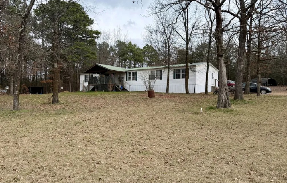 Mobile home on 3.01 acres- partially open and wooded! 4 bedrooms and 2 bathrooms with fireplace in living room.
