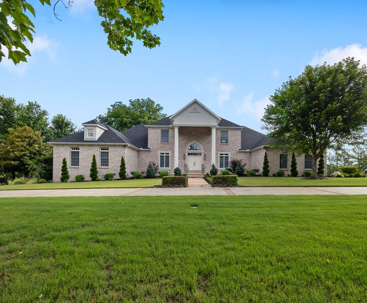 Immpecable home in Harber Meadows Subdivision! Radiating elegance throughout, offers a perfect blend of sophisticated design and everyday functionality. Grand living area boasts soaring cathedral ceilings and walls of windows that flood the home with an abundance of glorious natural light. Sleek, modern kitchen is a chef’s delight, with premium stainless steel appliances, ample prep space, and a seamless flow into both formal & informal dining spaces. Generously sized bedrooms with ample storage, alongside an ultra-functional laundry room. Entertain in style with a unique, fully enclosed indoor/outdoor kitchen featuring built-in grill and professional vent hood. Huge covered patio and extended open deck, overlooking a fully landscaped, picture-perfect yard enclosed by timeless wrought-iron fencing. Backyard greenhouse is ready for year-round gardening projects. Convenient access to I-49 and all that NWA has to offer. Meticulously maintained and structurally pristine, this gem offers luxury living at its finest!