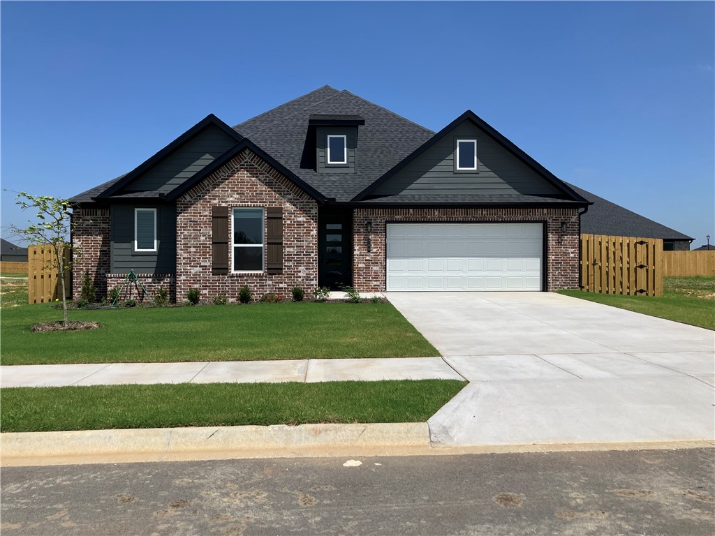 Located just off Highway 412, Bariloche offers quick access to major routes, making daily commutes and travel throughout Northwest Arkansas simple and convenient. The Mulberry floor plan features a layout that provides comfortable, functional space perfect for both everyday living and entertaining. Inside, bathrooms are enhanced with framed mirrors for a touch of sophistication, along with cabinets installed above the toilets to provide stylish and practical storage. Residents also enjoy access to the community dog park with path located at the back of the neighborhood. Fence, blinds, and gutters are all included.