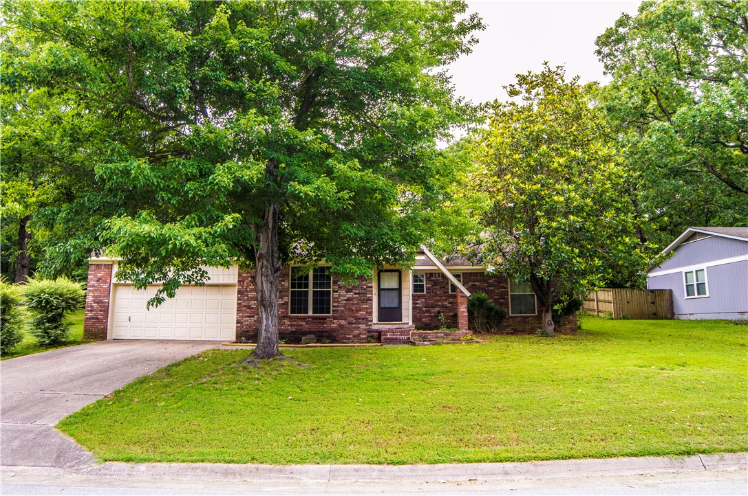 LOCATION, LOCATION, LOCATION!  This 3 bedroom 2 bath house has a new air conditioning unit and has recently been fixed up with new paint and flooring.  You are in the heart of Fayetteville with easy access to entertainment and restaurants.  The back of the house faces a wooded area, so you can enjoy the privacy and tranquility of the woods on your patio.