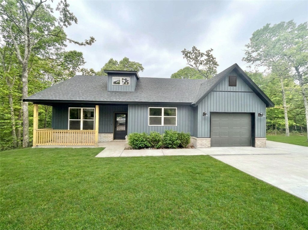Brand NEW Home in Bella Vista. Be the first to live in this stunning craftsman style 2 bed / 2 bath brand-new construction home on a large .32-acre wooded lot. Located on a quiet cul-de-sac in Bella Vista, this 1,222 sq. ft. home is just moments away from Branchwood Recreation Center, Lake Loch Lomond, Highlands Golf Course, and I-49! This exquisite home boasts high-end finishes throughout. Step inside to find a stylish open-concept layout, adorned with NO carpet. The focal point of the home is the kitchen, showcasing custom cabinets, 3cm quartz countertops, and a large kitchen island. The kitchen comes equipped with a new oven/range, microwave, refrigerator, and dishwasher. Stackable washer and dryer hookups available. 
Property has a single-car attached garage with additional paved parking space for a second vehicle. Quiet cul-de-sac location is within walking distance to Branchwood Recreation Center. Tenants will have access to Bella Vista amenities. Yard maintenance included.