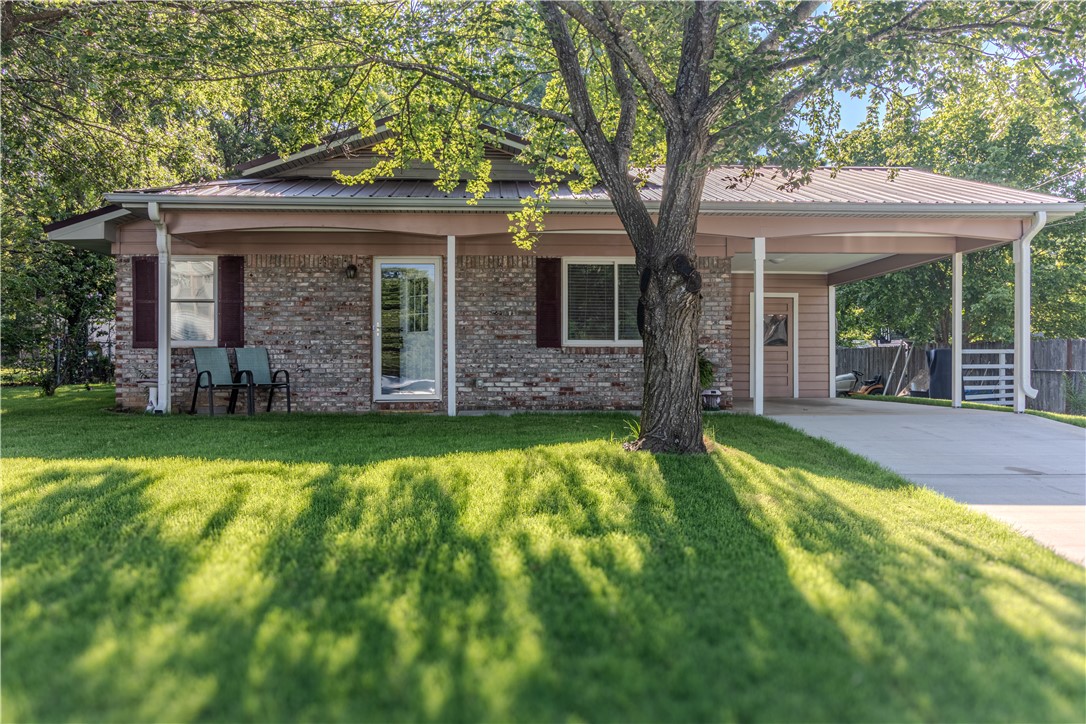 Completely remodeled and move-in ready in the heart of Prairie Grove. This home has been taken down to the details and rebuilt for worry-free ownership: new plumbing, new electrical, and a new gas line. Enjoy a durable metal roof and full brick exterior on all sides for lasting curb appeal and low maintenance. Inside, you'll find all-new flooring and carpet, fresh paint throughout, and a new HVAC system and water heater. The large, fully fenced backyard offers room to relax, garden, or entertain, and the generous lot size leaves room to expand the existing home and make it your own down the road. With the big-ticket items already handled, there is no guesswork here. Located minutes from downtown Prairie Grove shopping, dining, and everyday conveniences.
