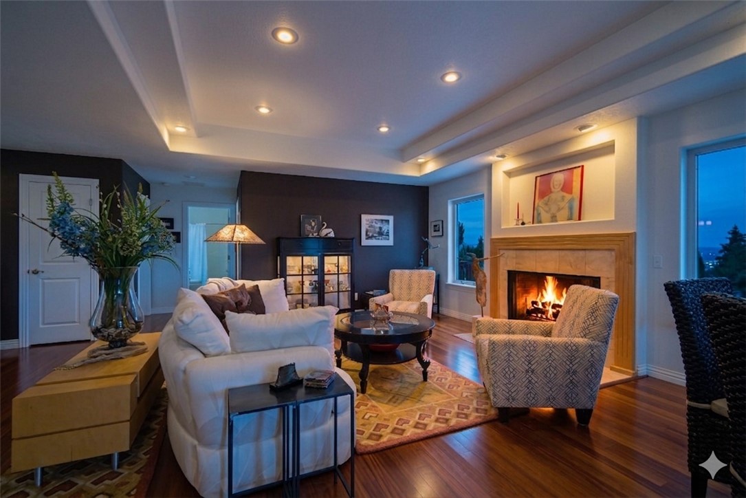 Custom built & lovingly maintained by its original owner, this beautifully designed home showcases quality craftsmanship, thoughtful updates, & exceptional flexibility. Elegant trey ceilings, bullnosed corners, & spacious light-filled living areas with a wood burning fire place create an inviting feel. The kitchen features new appliances (they convey), along with a convenient pantry with sliders, warming drawer & double oven for added functionality. Recent improvements include a water heater, HVAC (2023) & whole-house Culligan system for peace of mind. The finished walk-out basement offers a spacious second living area, gas fireplace, wet bar, generous storage, deck access, & flex space that could function a 4th bed/office w private balcony. Primary suite & 1 upper bedroom also offer deck access, where you can enjoy lake views. A breezeway connects the home to the oversized garage. Wired for partial house, the generator hookup is already installed, and the mobile generator conveys. Schedule your showing today!