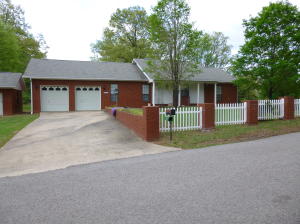 Very nice home on bluff overlooking Russellville River Valley. 2 car garage and a carport for a boat or RV.Home comes with an extra lot of .1 ac. to left of house. Nice large deck.Extra brick storage building for your tools and mower. Great buy.