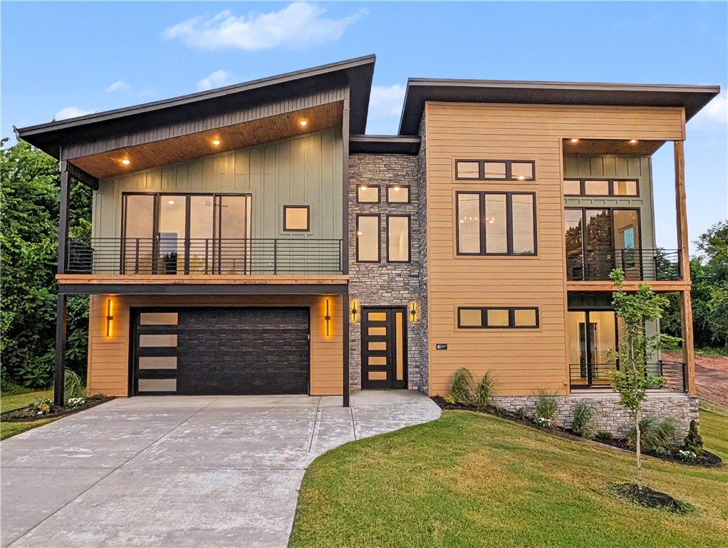 Welcome To Your Next Home! If Beige Boxes And Builder-Grade Boredom Make You Yawn, Buckle Up, Because This One Is A Whole Mood. Mountain Modern To Its Core, It Throws Sharp Rooflines, Warm Multitone Siding, And Stacked Stone Together Like It Was Born On A Magazine Cover. Step In On The Lower Level, Then Head Up Where The Home Really Shows Off. Tongue-And-Groove Vaulted Ceilings Glow Over A Wide-Open Living Space, And The Star Of The Show Is A Floor-To-Ceiling Stone Fireplace Practically Daring You To Pour A Drink And Stay Awhile. Sunlight Pours Through Walls Of Windows From Every Angle. The Kitchen Flexes Hard With An Oversized Island, Brooding Custom Cabinetry, A Fluted Statement Hood, And Granite For Days. Bathrooms Channel Boutique-Hotel Drama Through Inky Vertical Tile And Frameless Glass, While The Built-In Mudroom Keeps Real Life Sharp. Triple Covered Balconies And Porch Areas And A Spacious Deck Give You Multiple Spaces To Soak Up Every Season. This Is Not A House You Scroll Past. Come See!