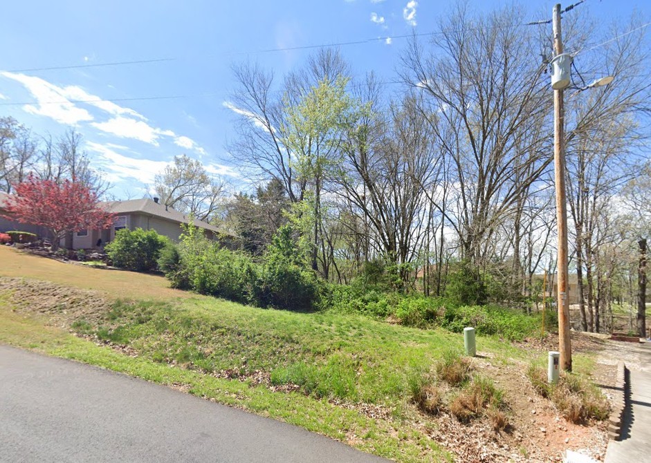 Buildable 0.31-acre parcel nestled on Sable Drive in one of Bella Vista’s most appealing neighborhoods. The lot offers excellent proximity to golf courses, lakes, fitness centers, and tennis amenities, while the dog park and walking trails are just a short distance away. Gently sloping terrain with mature trees provides a scenic backdrop for your custom home design. Imagine relaxing on your porch surrounded by natural beauty, yet being only minutes from all the conveniences Bella Vista has to offer. Perfect for full-time living or a weekend getaway, this location brings peaceful living and community activities together.