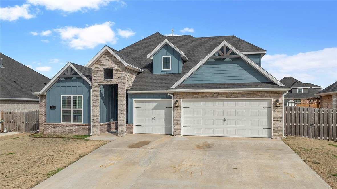 Welcome to this beautifully designed home in the heart of Pea Ridge! 

Built in 2022, this move-in-ready home blends modern finishes with a functional layout. The open living area features soaring vaulted ceilings and flows seamlessly into the kitchen and dining space, making it ideal for entertaining. 

The kitchen offers granite countertops, soft-close cabinetry, and ample prep space, while the dining area showcases a charming shiplap accent wall. Enjoy the covered patio and fenced backyard. The split floor plan provides a private primary suite with dual vanities, a soaking tub, and a spacious walk-in closet connected to the utility room. A second bedroom and full bath are on the main level, with two additional bedrooms and a third full bath upstairs. 

The 3-car garage includes a climate-controlled flex space currently used as a workout room. New carpet was installed in all bedrooms in February 2026. Conveniently located near local amenities, including the community pool.