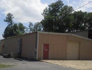 MOTIVATED SELLER! May consider owner financing, with the right offer! Great Hwy. 64 location! Multiple business opportunities for this highly visible commercial property situated on one acre. Access from both Cherry Street and Hwy. 64. Car lot with mechanic garage, warehouse, flea market, consignment store---endless possibilities! Asphalt parking lot, 20+ spaces. 2400 sq. ft. metal building, concrete floor, red iron, two exterior doors; one 10' x 12' overhead door. Building has Cherry Street address.