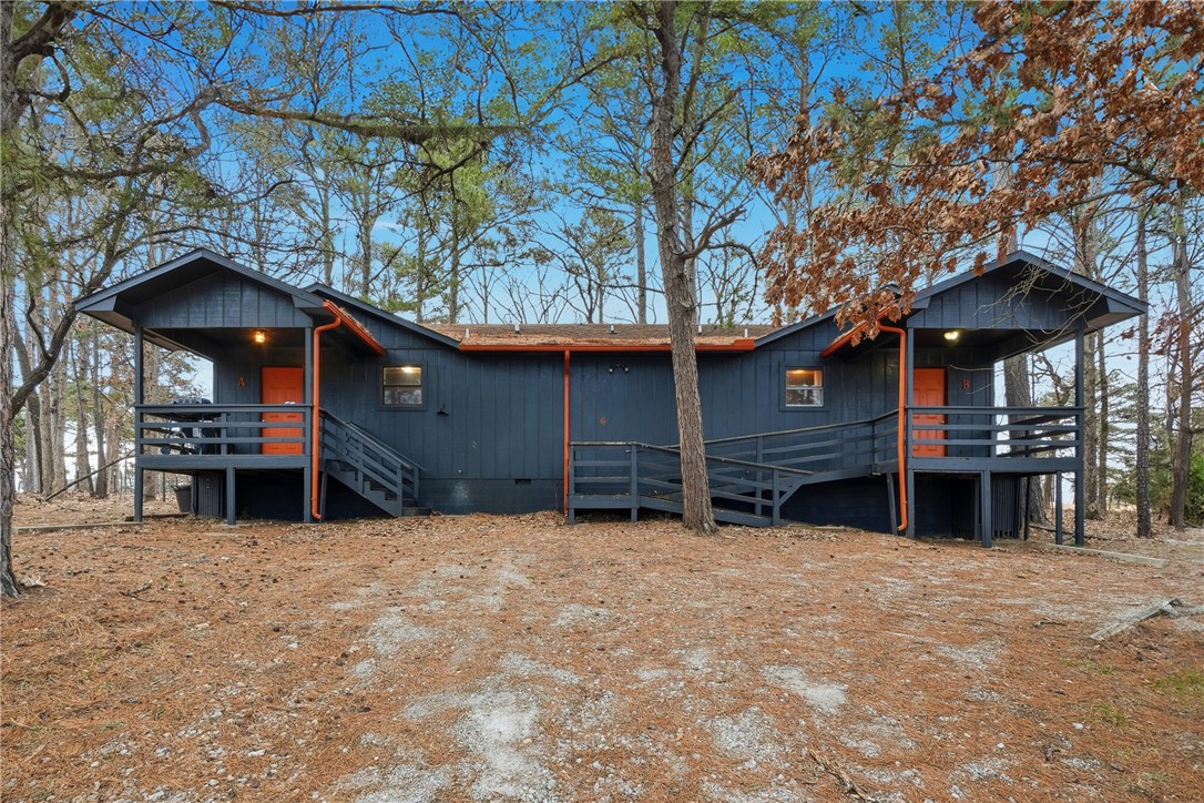 Updated golf-course duplex with strong income potential and flexible rental options in Holiday Island. Each side offers a 1 bed/1 bath layout with full kitchen, all appliances included, plus in-unit washer/dryer and wood-burning fireplace. Both units feature private back decks overlooking the 6th hole of Holiday Island’s 18-hole golf course.
Major updates completed in 2021 include new vinyl flooring, fresh interior/exterior paint, new kitchen counters and sinks, new light fixtures, and fully renovated bathrooms with new tile, vanities, tubs, toilets, and shiplap accents. A connecting double-door allows units to operate separately or function as one larger residence, ideal for multi-generational living or varied rental strategies.
Currently vacant for easy showings and immediate rental setup. Ideal for long-term tenants, short-term rentals, or owner-occupancy with supplemental income. Located less than 5 minutes to Holiday Island amenities and only 15 minutes to Eureka Springs.