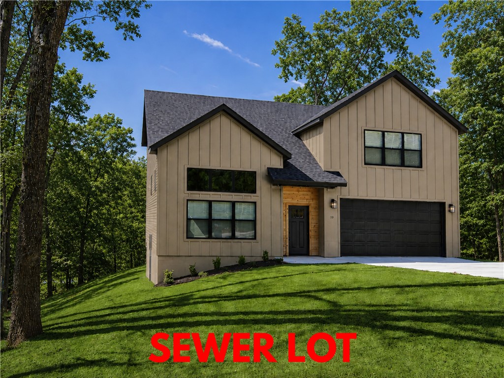 Stunning new construction home on a large .40-acre wooded cul-de-sac sewer lot! 3 bedrooms / 2.5 baths + bonus. Easy access to The Back 40 Trailhead and Lake Windsor! Step into a bright and airy interior featuring tall ceilings and a striking 2-story fireplace. The kitchen boasts custom cabinets, a gas range, and 3 cm quartz countertops. The primary bath features a luxurious soaking tub and a walk-in tile shower. Enjoy abundant natural light throughout, and entertain on the spacious deck overlooking the serene landscape. High-end finishes throughout. Bentonville schools! As an added bonus, receive $5,000 towards buyer's closing costs when working with the builder’s preferred local lender! Schedule your showing today!