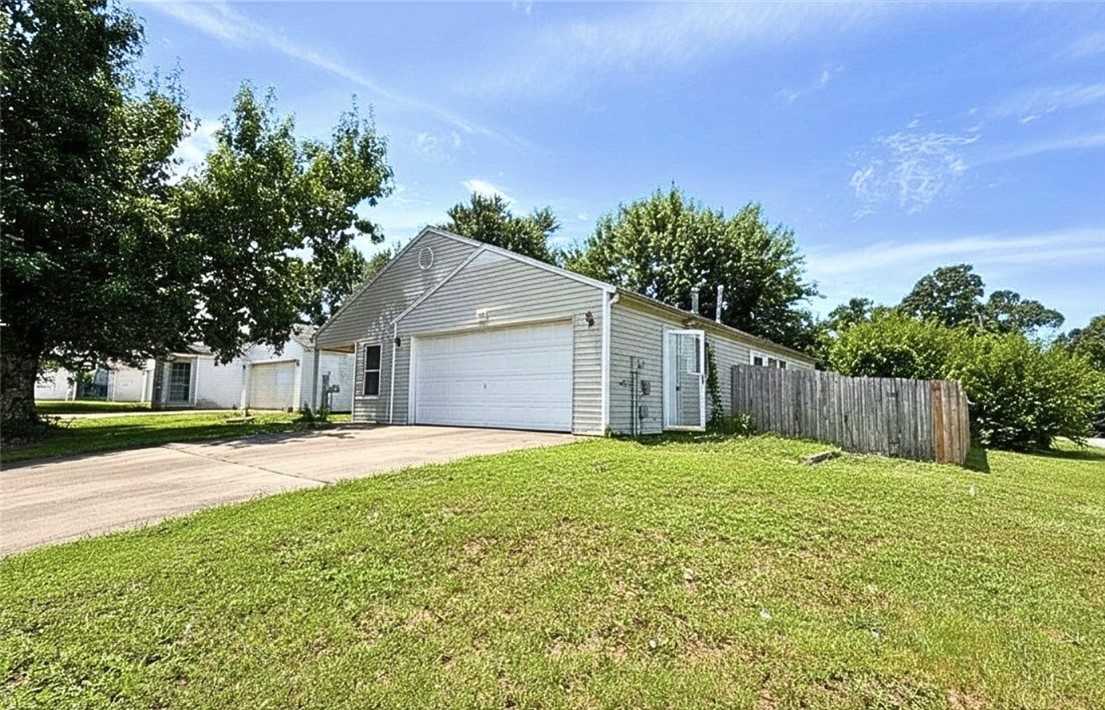 Opportunity in the heart of Bentonville! Located just minutes from Crystal Bridges Museum of American Art, the new Walmart Home Office Campus, downtown Bentonville, and all the amenities that make this one of Northwest Arkansas' most desirable areas, this 3-bedroom home offers exceptional potential for homeowners, investors, or those looking for a project in a prime location. The home features a converted garage that has been used as a studio-style living space, providing flexible options for a home office, hobby area, guest quarters, or additional living space. While the property could benefit from cosmetic updates, including flooring and general cleaning, it offers a rare chance to build equity in an area where demand continues to grow. Whether you're looking for your next investment property, a renovation project, or an affordable entry point into Bentonville, this home is worth a look. Conveniently located within approximately two miles of both Crystal Bridges and the new Walmart Home Office Campus.