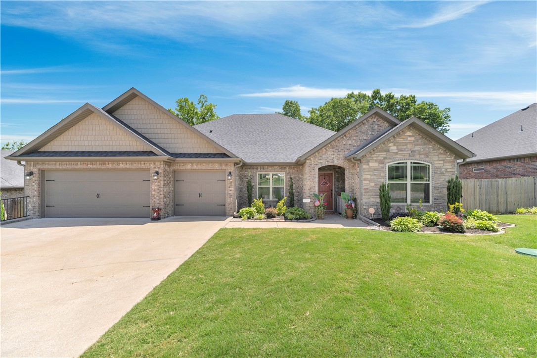 New price of $575,000! Qualified buyers may receive up to 1% of the loan amount toward closing costs through preferred lender Angie Molina with Benchmark Mortgage. Recent updates include a brand new roof (May 2026), new AC unit (July 2025), full-home surge protector (October 2024), tankless water heater, upgraded appliances, smart thermostat, and updated lighting. Tucked behind peaceful family farmland with no homes directly behind it, this all-brick home offers privacy and sunset views that are hard to find. The covered back patio with fireplace and upgraded outdoor grilling area creates the perfect setting for entertaining and relaxing. Inside, the kitchen features granite countertops, double ovens, and a large walk-in pantry. The spacious primary suite offers a large tile shower, jetted tub, and oversized closet. Located in the highly sought-after Bentonville School District, this home offers a rare combination of updates, privacy, and beautiful views.