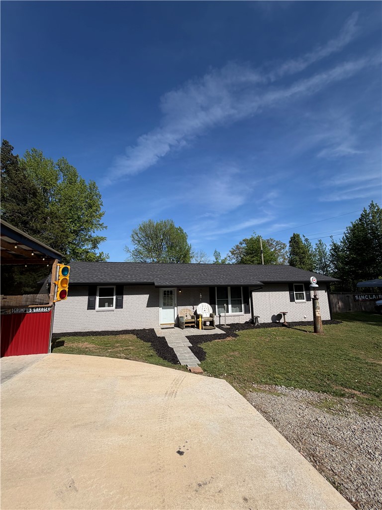 MY OH MY!!!!! So much has been done in such little time. This 3 bedroom 1 bathroom home has new roof, new gutters, new deck, new windows, some new flooring, some new paint inside and out, NEW FULL HOUSE AND SHOP generator, new septic and lines, brand new 30X60 shop with 900 sq ft of it is heated and cooled, hot tub negotiable