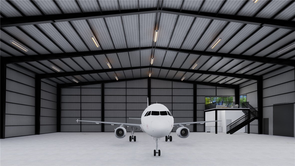 Brand new construction. Check out this new 117' x 85' hangar at the Springdale Airport to be completed December 2026. This hangar is 26' in height with a 20' x 60' Schweiss hydraulic door with remotes and a 10' x 12' drive in door. Hangar also includes a kitchenette, bathroom, and 800 sqft mezzanine lounge. It also has 7 windows on the mezzanine level area for natural light. Plenty of electrical outlets and high bay LED lighting. Back-up generator. Private entrance with secure parking.