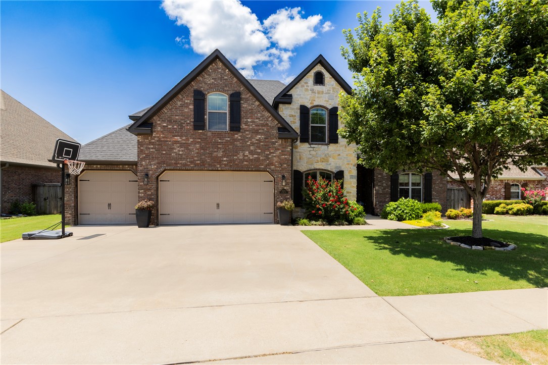 Welcome to this beautifully maintained 5-bedroom, 4-bath home in the highly sought-after Silo Falls neighborhood! This spacious floor plan features a formal dining room, bonus room, and an open-concept living area with a gas log fireplace. The stunning kitchen offers a large island with prep sink, granite countertops, soft-close cabinetry, double ovens, gas cooktop, and abundant storage. Retreat to the large primary suite, complete with double vanities, a custom tile shower, a corner jetted tub, and a walk-in closet that connects directly to the laundry room. A second bedroom and full bath are on the main level, with three additional bedrooms, two full baths, and a bonus room upstairs. Enjoy the covered patio with built-in grill, fenced backyard, multiple french drains, sprinkler system, built-in storm shelter and a new roof in 2023. Neighborhood amenities include a community pool and playground, all just minutes from shopping, dining, and schools. Don't miss your chance to own this amazing home—it won't last long!