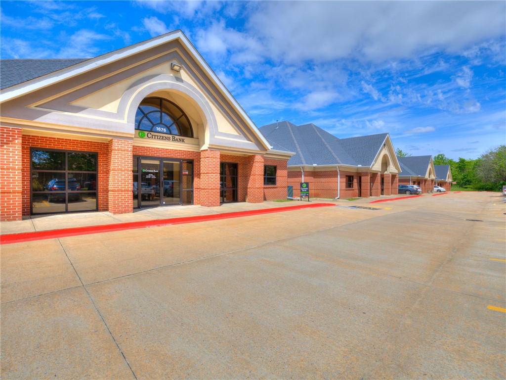 Exceptional opportunity to lease a highly visible, turnkey financial services facility prominently situated along Joyce Blvd. This purpose-built bank branch offers immediate functionality for financial institutions, credit unions, insurance offices, or professional service firms seeking a high-traffic, move-in-ready space.

Property Highlights:
 — Convenient customer-facing drive-thru lane ideal for financial transactions or service-based operations
 — Secured, built-in vault provides unmatched security infrastructure for financial or high-value operations
 — In-place ATM available
 — Clean, contemporary build-out featuring an open, welcoming lobby, teller areas, and private offices — move-in ready with minimal tenant improvement needed
 — Dedicated on-site parking for customers and staff

Don't miss this rare chance to occupy a well-established, modern financial facility in a strong commercial corridor.