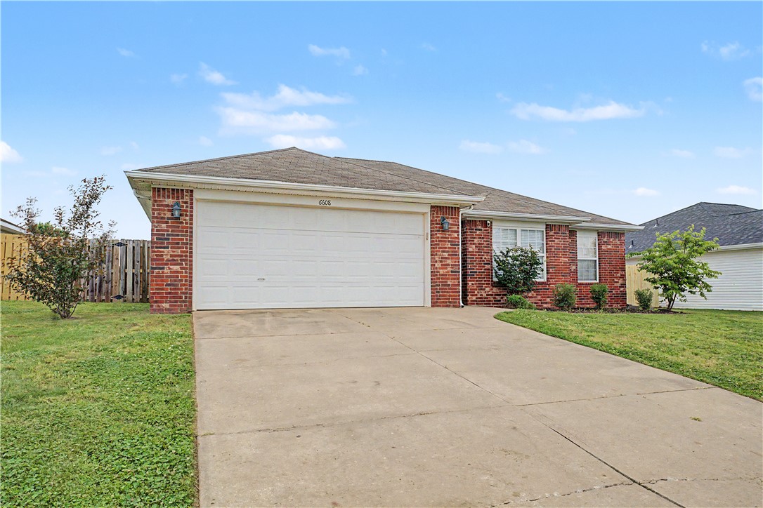 A 3-bedroom, 2-bath, 2-car garage home in Bentonville priced under $270,000. This home features fresh paint throughout the entire interior, creating a clean, updated feel from the moment you walk in. Enjoy a cozy gas fireplace in the living area, along with a covered back patio and fully fenced yard—perfect for relaxing or entertaining. The primary suite offers a generous walk-in closet, and the layout provides comfortable, functional living. Conveniently located near the airport, local schools, and everything Bentonville has to offer.