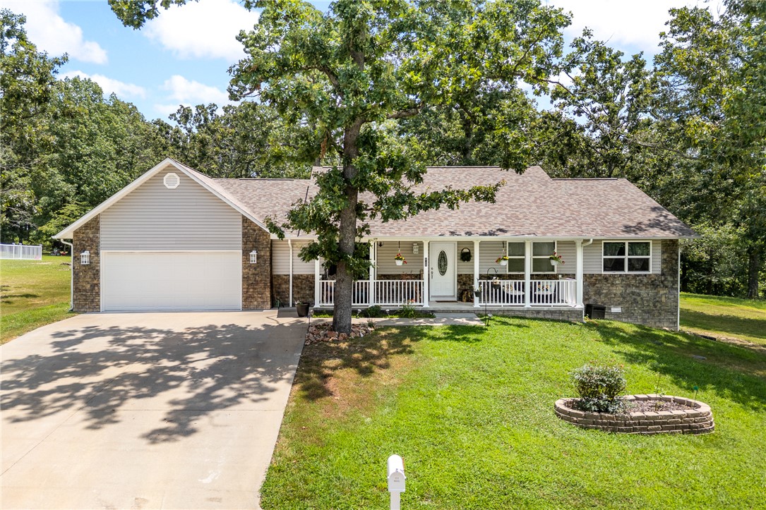 Newer construction, mature setting! This 2021 home sits on 1.29 landscaped, wooded acres near the cul-de-sac in Oak Park Estates. Inside you'll find an open floor plan with cathedral ceilings, a spacious kitchen with granite counters and large island, 3 bedrooms, 2 baths, and walk-in closets with storage galore. Relax on the covered patio or take in the big front and back yards. Located just outside city limits on a paved road, but only minutes to everything Harrison offers. Move-in ready with a 2-car garage and storage building with loft!