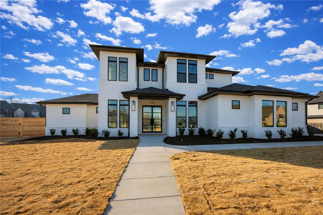 Experience luxury living in this Lance Johnson Building Company masterpiece, showcasing the award-winning plan from their 2024 Parade of Homes. This stunning two-story design strikes the perfect balance of openness and privacy. On the main level, enjoy two bedrooms, 2.5 bathrooms, a spacious open living and kitchen area, hidden pantry, bonus room, office, large laundry, and an inviting patio with built-in grill, mini fridge, and pullout trash. The gourmet kitchen impresses with JennAir appliances and a hidden pantry seamlessly tucked behind custom cabinetry. The primary suite is privately situated with its own patio and spa-like bath, offering a true retreat. Upstairs, a floating staircase leads to two additional bedrooms with ensuite baths and a large versatile common area, ideal for a library, study, or cozy reading nook. Beyond the home, enjoy neighborhood amenities including a sparkling pool and tennis courts, creating the perfect blend of elegance, comfort, and lifestyle.