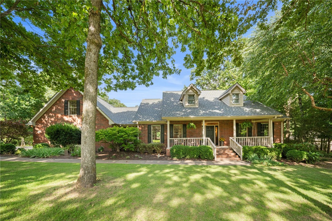 Timeless, custom-built brick Cape Cod situated on an acre and a half in one of Fayetteville's most sought-after neighborhoods.  Featuring site-finished oak hardwood floors, Andersen windows, 2x6 construction, a wood-burning fireplace with stone hearth,  extensive built-ins and covered outdoor living spaces in both the front and back, this home exudes classic style and quality.  Tucked away in the back of the neighborhood on a quiet cul-de-sac with mature trees throughout the property, this special home offers an exceptionally peaceful, natural setting and enduring charm.