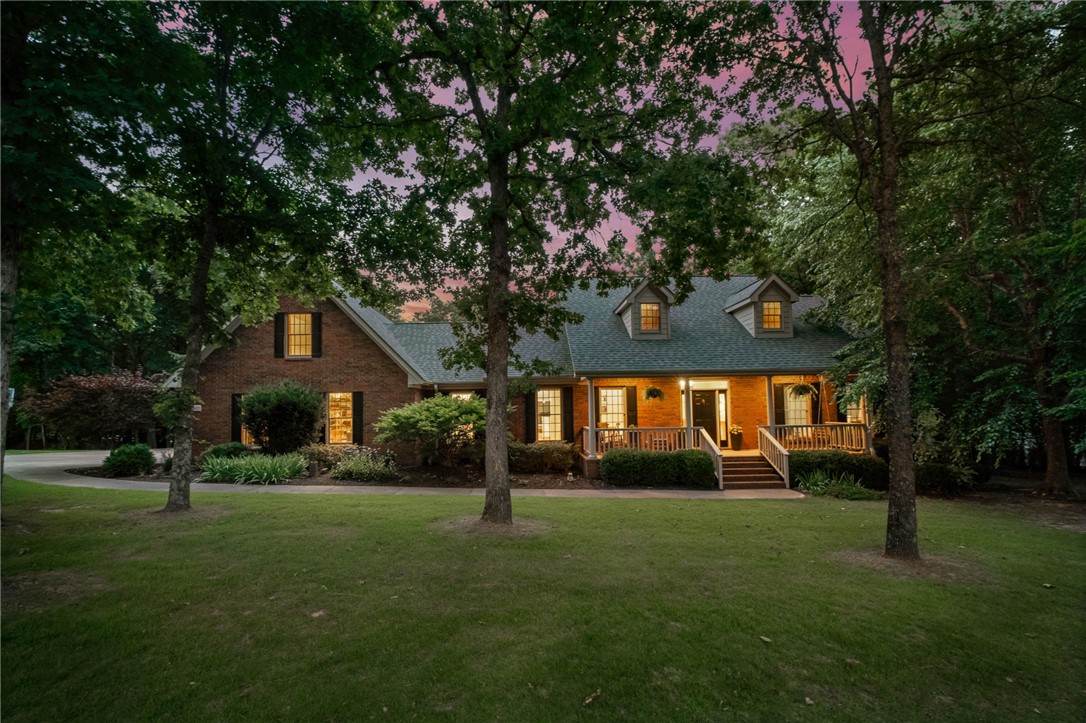 Timeless, custom-built brick Cape Cod situated on an acre and a half in one of Fayetteville's most sought-after neighborhoods.  Featuring site-finished oak hardwood floors, Andersen windows, 2x6 construction, a wood-burning fireplace with stone hearth,  extensive built-ins and covered outdoor living spaces in both the front and back, this home exudes classic style and quality.  Tucked away in the back of the neighborhood on a quiet cul-de-sac with mature trees throughout the property, this special home offers an exceptionally peaceful, natural setting and enduring charm.