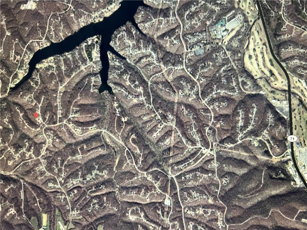 Buildable Lake and Trail Lot!  ~600 ft from Wake-Friendly Lake Windsor and ~600 ft from Tunnel Vision Trail near the Up Hills Both Ways intersection!!  Beautiful lot off of Pimlico Drive, right off of Chelsea Road And in Bentonville School District!   Tweety Bird, Little Sugar, LandLine, Tavistock Canyon, etc and Kingsland Golf Complex and Much more with in 1.5 miles.  Access,  Opportunity, AND Location with this lot!  Bella Vista is a fast growing community exclusively focused on Outdoor Resort & Recreation Living.  This lot is in the Southwest Corridor of Bella Vista, as is the newly Oz Trail Park!  If you know, you know...