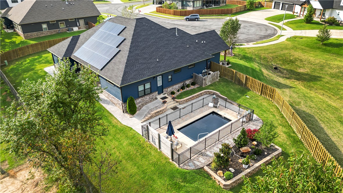 You could buy new construction, but it won’t come with a private heated pool, paid-off solar panels, a tornado shelter, and a whole-home Generac natural gas generator. And that’s just the beginning. This home is packed with upgrades & details that truly make it special. You need to see it in person to fully appreciate it.
This 2021 build offers an open-concept filled with natural light featuring beautiful flooring and a cozy corner fireplace. The kitchen is a standout with JennAir appliances, stunning countertops, and seamless flow into the living and dining areas.
All 4 bedrooms, plus a dedicated office featuring a custom pecan slab desktop, are conveniently located on one level. Step outside to your private retreat, complete with a paved walkway leading around the yard from a gated in-ground saline pool to a Blaze outdoor kitchen under a covered patio and all the way to the heated & cooled 3-car garage with epoxy floors and built-in cabinetry. 
Ask for the video & 3D tour, or schedule your private showing