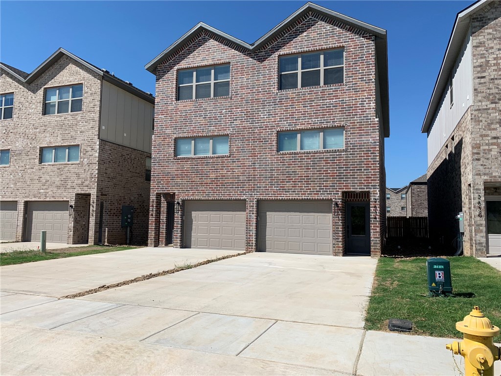 AMAZING location right across from the newly remodeled Osage Park, Lake Bentonville, and Bentonville airport (private planes only, so not excessively noisy). Quick access to Climb Bentonville, Bentonville Brewing, 10 minutes to Walmart HQ, and less than 15 minutes to Bentonville Square. 2nd level features open living room with great lighting and modern fixtures. Kitchen has stainless steel appliances, beautiful white painted cabinets with white quartz to give it that clean, modern look. The master bath has marbled walk in shower with double vanity. 3rd floor features 2 guest bedrooms, full bath, small office space, and HUGE storage room. Main level is a tandem 2 car garage, additional large storage area then access to the fenced in backyard with a patio slab!. Call office for more details. Fireplace does not work.