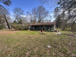 If you've ever dreamed of your own little homestead, tucked back in the woods, but not too far from a store, than this property may just be what you're looking for. Tucked in between local farms, & woods, this beautiful 1 bed, 1 bath, home is placed on 3 acres of land, with some pins that used to hold goats and chickens. The shade given by the tree makes the days spent there cool and beautiful, even if SOME trees took their job a little too seriously. Now it just needs to be chopped up to be used for summer nights relaxing with good friends enjoying this beautiful location!