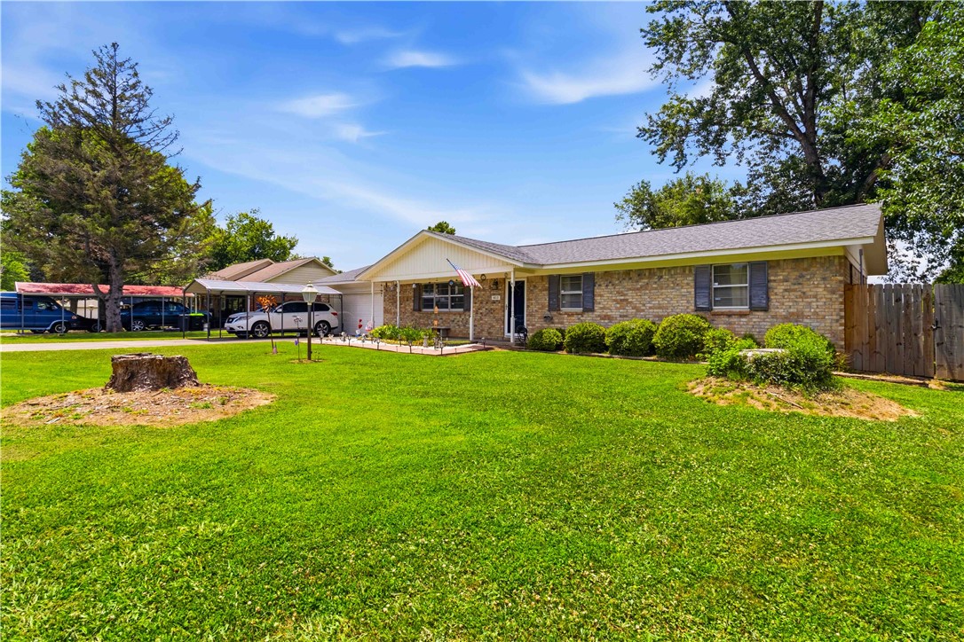 Welcome home to this incredible Rogers gem! This beautifully maintained 3-bedroom, 2-bath brick home offers 1,788 sq. ft. of comfortable living on an oversized 0.44-acre lot in the heart of Rogers. Enjoy a whole-home Generac backup generator (2024), a hot tub for year-round relaxation, two storage sheds, and a 2021 HVAC system. With its spacious layout and standout amenities, this beautiful home delivers comfort, convenience, and value.