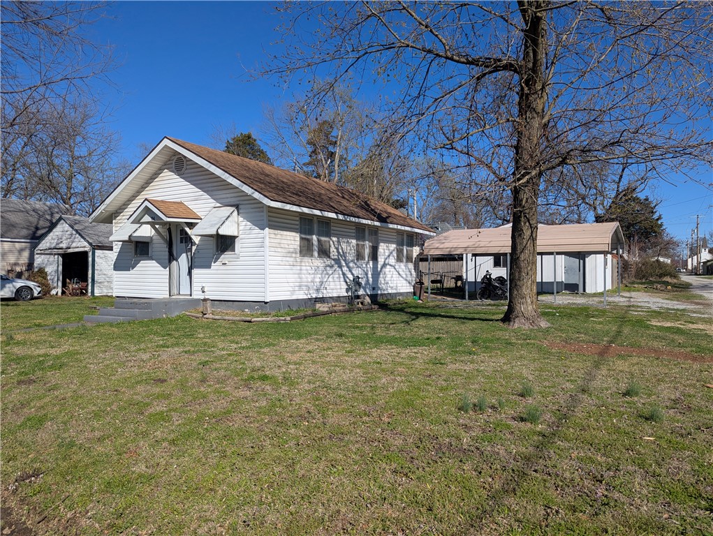 Back on the market do to no fault of the seller! Quaint 2 bed 1 bath home in a desirable area of Gentry! The interior features laminate wood flooring in the main living area and ceramic flooring in the kitchen and bathroom. Great Opportunity for an investor. The insulated outbuilding has an unfinished living space with room for a kitchen, bedroom, and bathroom, great for a quick refurb! Total for both buildings is 975sqft. Foundation is Closed pier and beam. The outdoor space is perfect for weekend projects, featuring a detached insulated building and a sturdy double carport.  The property also includes a detached metal carport offering convenience and protection. Located just minutes from Hwy 59, you’re perfectly positioned for an easy commute to Siloam Springs, Fayetteville, or Bentonville while enjoying the quiet, friendly pace of Gentry life.