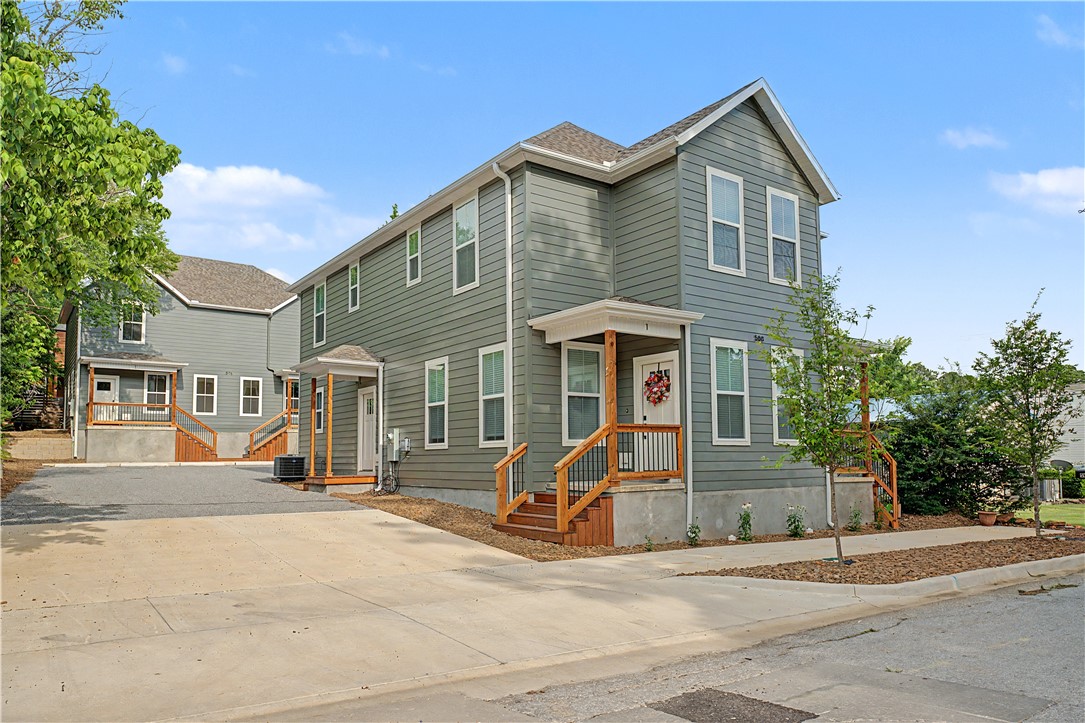 An individual townhome just minutes from the U of A campus and walking distance to the heart of downtown Fayetteville, this newly built townhome sits in an unbeatable spot right off MLK, with preferred lender options available on request. The main level is thoughtfully designed for everyday ease, bringing together the living area, kitchen, dining space, a convenient half bath, and in-unit laundry under one open footprint, while the second floor hosts two generously sized bedrooms, each paired with its own en-suite full bath for maximum privacy. Whether you are looking for a place to call home or a smart addition to your rental portfolio, this combination of fresh construction, practical floorplan, and standout location makes it a property worth a closer look.