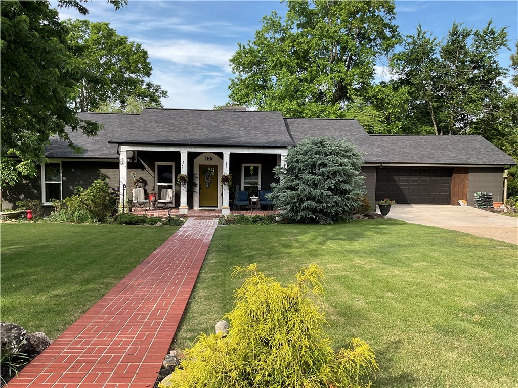 Beautifully maintained home in a desirable Harrison neighborhood! This spacious 3-bedroom, 3-bath home offers comfort, character, and exceptional curb appeal. Featuring a 2-car garage and a thoughtfully designed layout, the property is highlighted by stunning water features, double lot,  and a gorgeously landscaped yard that creates a peaceful outdoor retreat.  The updated chef’s kitchen is perfect for cooking and entertaining, offering modern touches and functionality for everyday living. Updates throughout the home provide a fresh, move-in-ready feel, blending style and comfort seamlessly. Enjoy peace of mind with a new roof and gutters.   Inside, you’ll find inviting living spaces ideal for relaxing or gathering with family and friends, while the beautifully maintained exterior showcases mature landscaping and tranquil garden accents that make this property truly stand out. This exceptional home offers the perfect blend of beauty, convenience, and Ozarks charm.