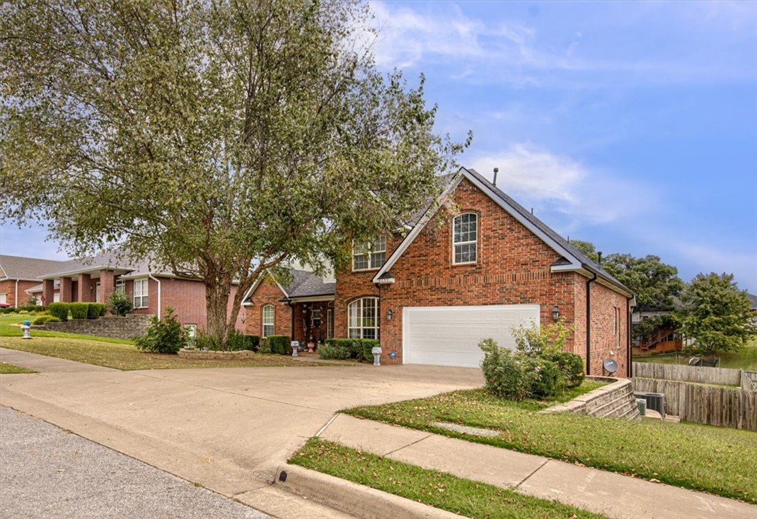 ALL BUYERS LOOK NOW!!  $5,000 SELLER CREDIT TO HELP YOU BUY DOWN YOUR RATE!! Or use this credit however desired this is a great opportunity for a home like this in the middle of the hub of NWA, just 2 miles from 49, 5 mins to everything else, close to the new children’s hospital along with so many other amenities.  This seasoned established neighborhood offers so much to its futures owner.  The home features a spacious layout and a cozy fireplace that beckons you to unwind with an open kitchen concept. The Main floor offers the owner suite and ½ bath for guests.  All other rooms upstairs with amply space and 2 bathrooms upstairs.   Step outside onto the expansive deck, which offers great entertainment space or a relaxing outdoor setting.  A picturesque view of the fully fenced flatter usable backyard, providing ample space for outdoor activities.   A lower-level covered deck is hidden there for all your hammocks or lounging shaded enjoyment.  Come see this gem before it’s no longer available.
